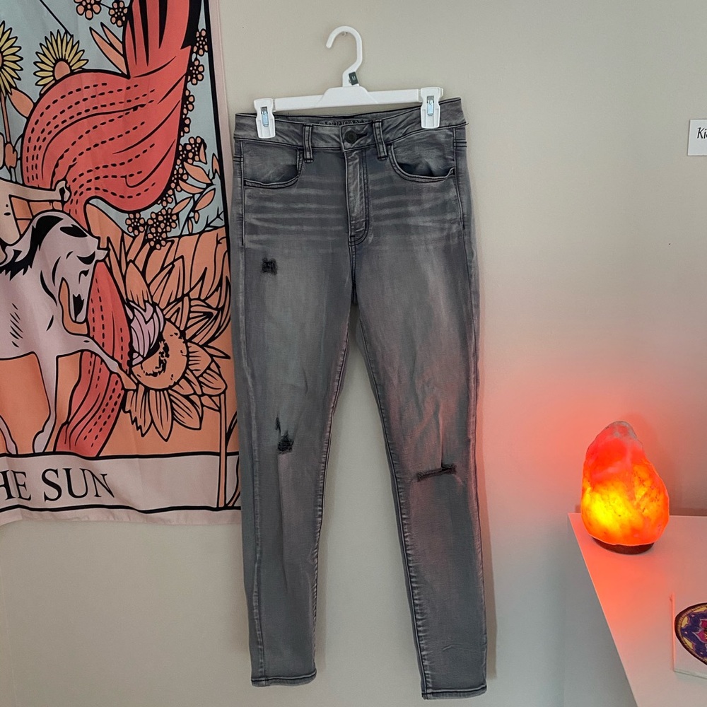 Grey acid wash high rise  jeans.